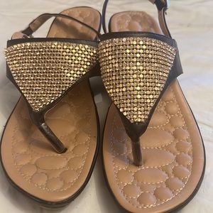 Gold and black sandals